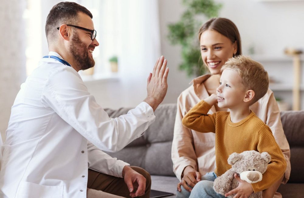 doctor and mother with child in family clinic